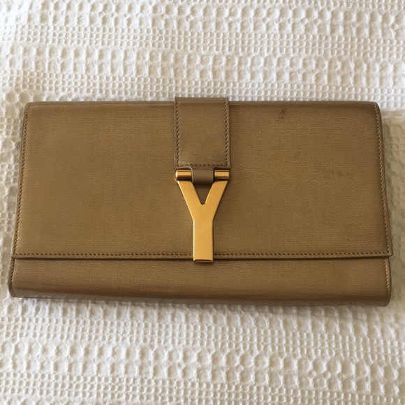 Yves Saint Laurent Handbags - Yves Saint Laurent Gold Patent Leather Y Clutch